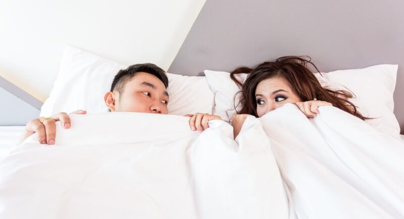 Reconnecting: Man and woman under the covers