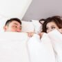 Reconnecting: Man and woman under the covers